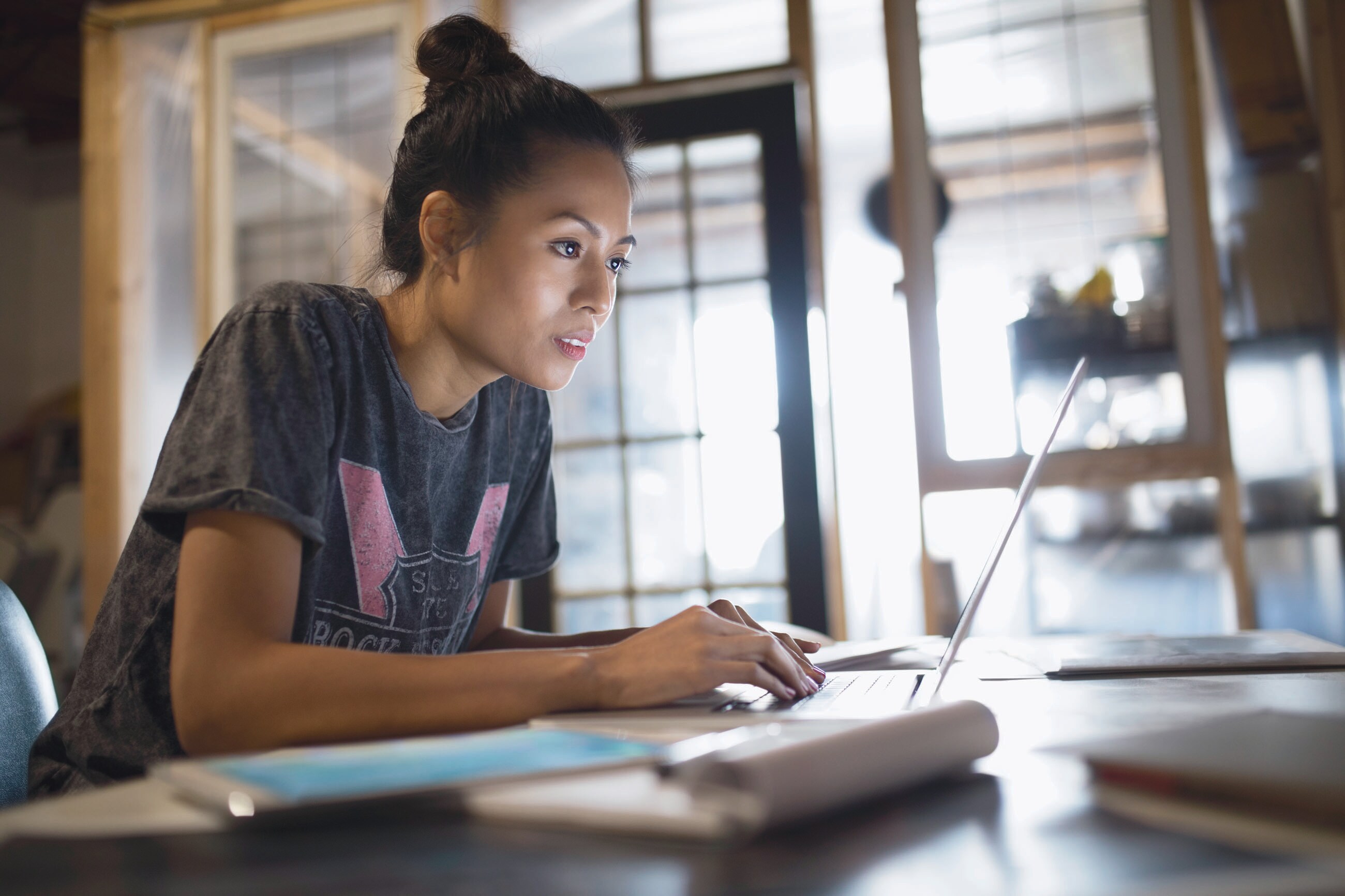 Woman sitting in front of laptop