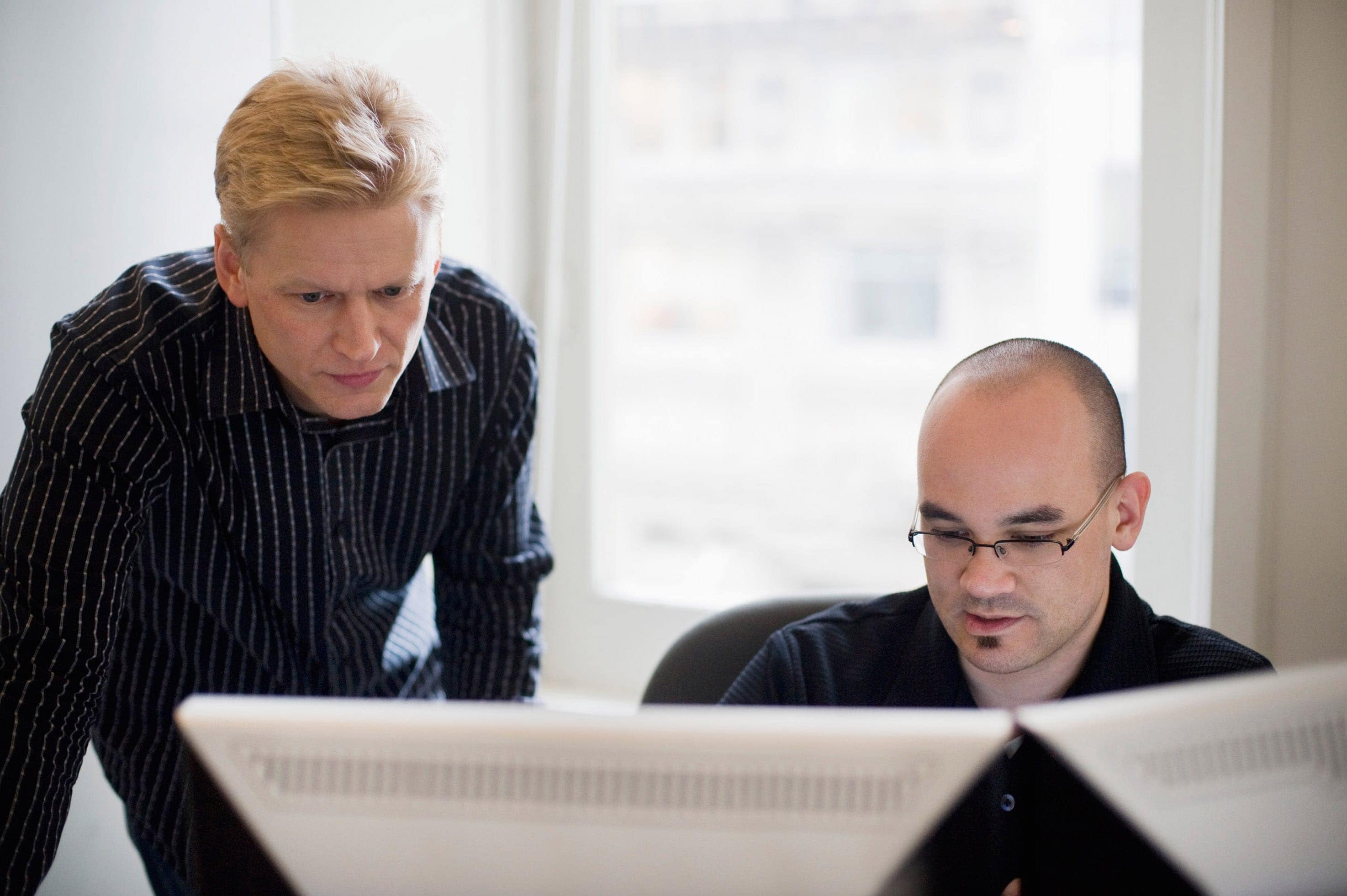 Office colleagues reviewing detect