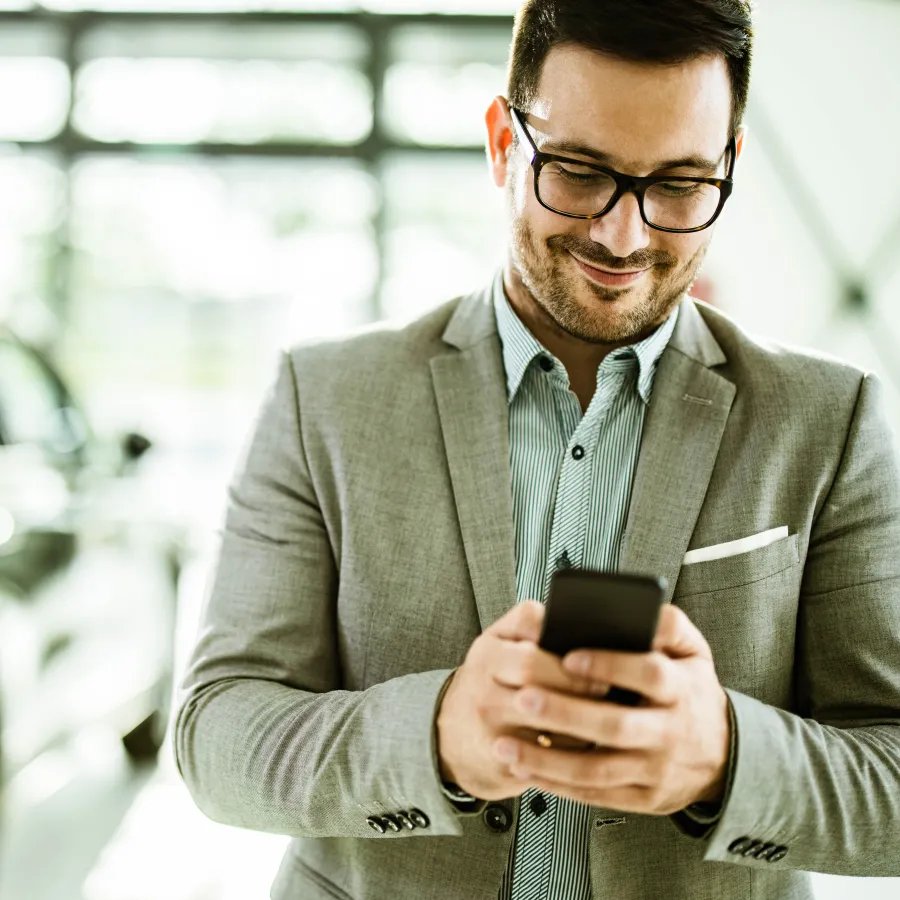 man using app on his phone for travel
