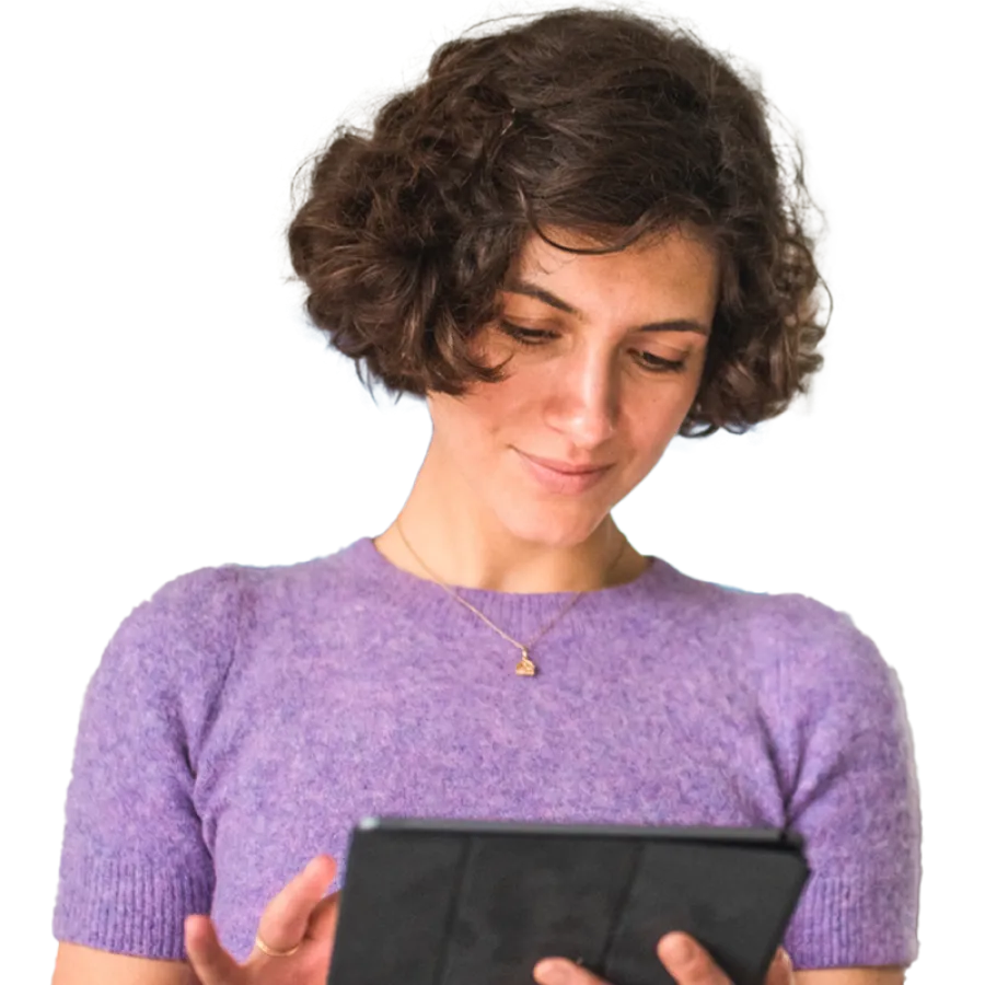 woman looking at tablet